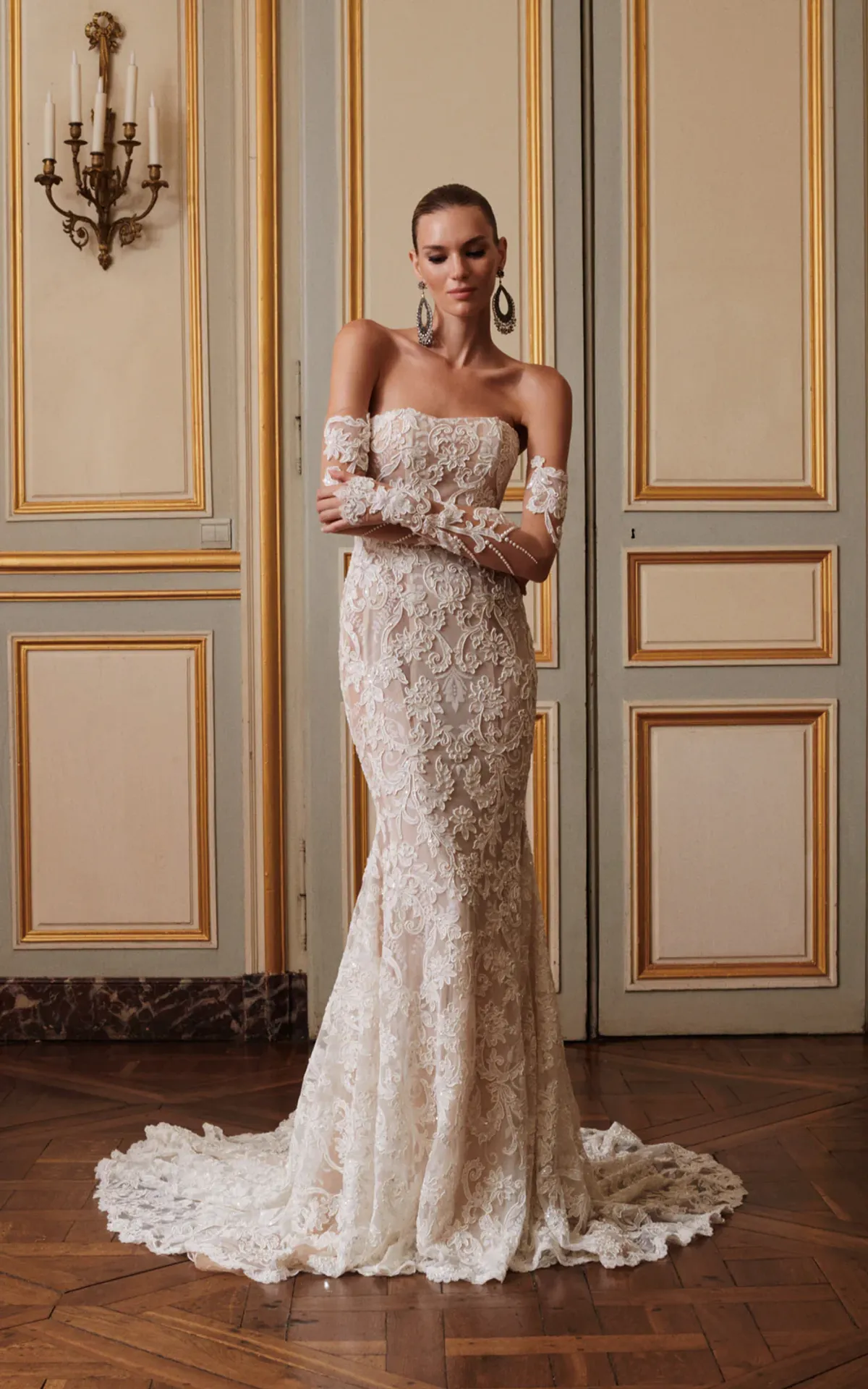 A model showcases the Galia Lahav Bijou dress from the Couture collection in a ballroom