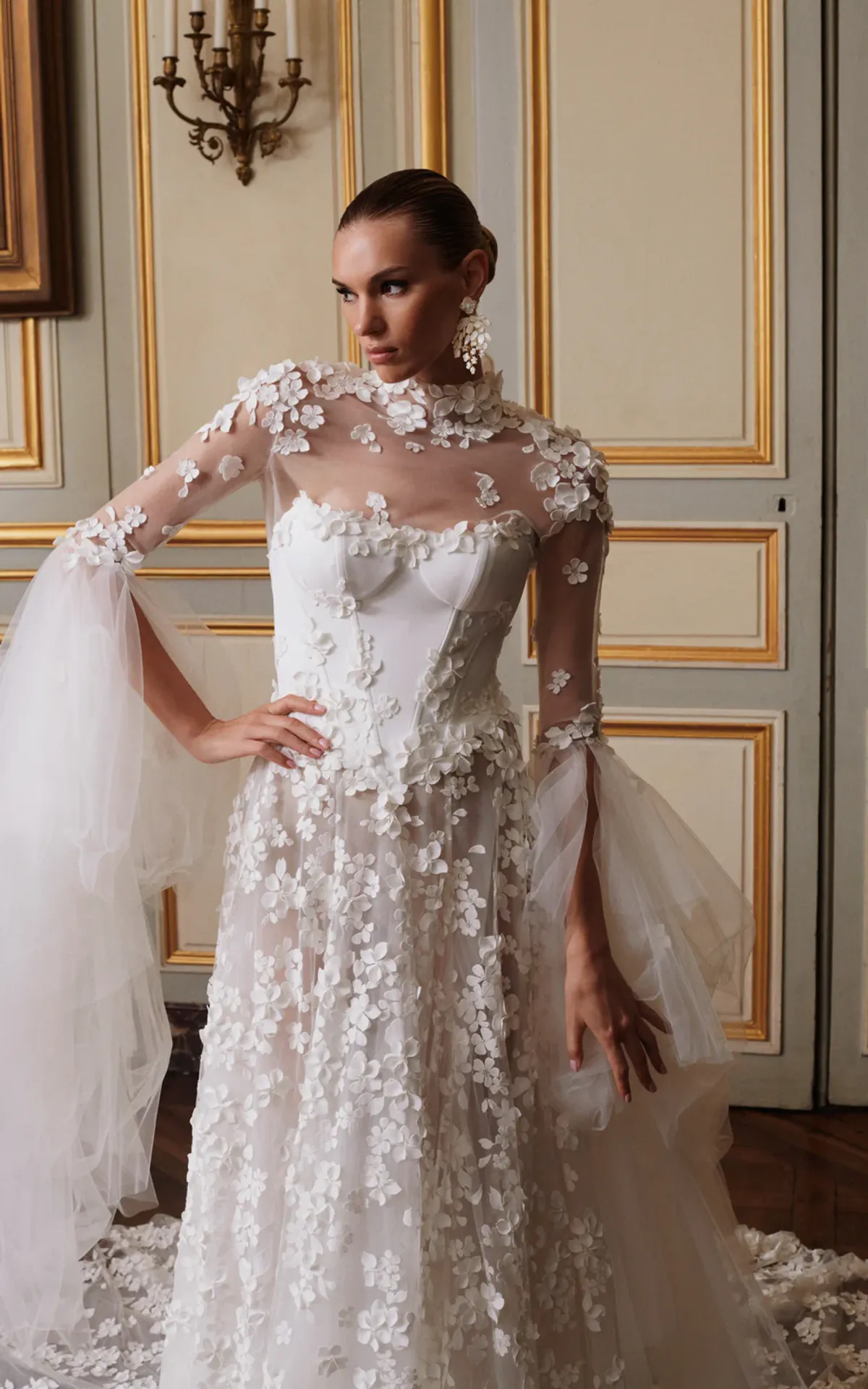 A model showcases the Galia Lahav Nadine dress from the Couture collection in a ballroom