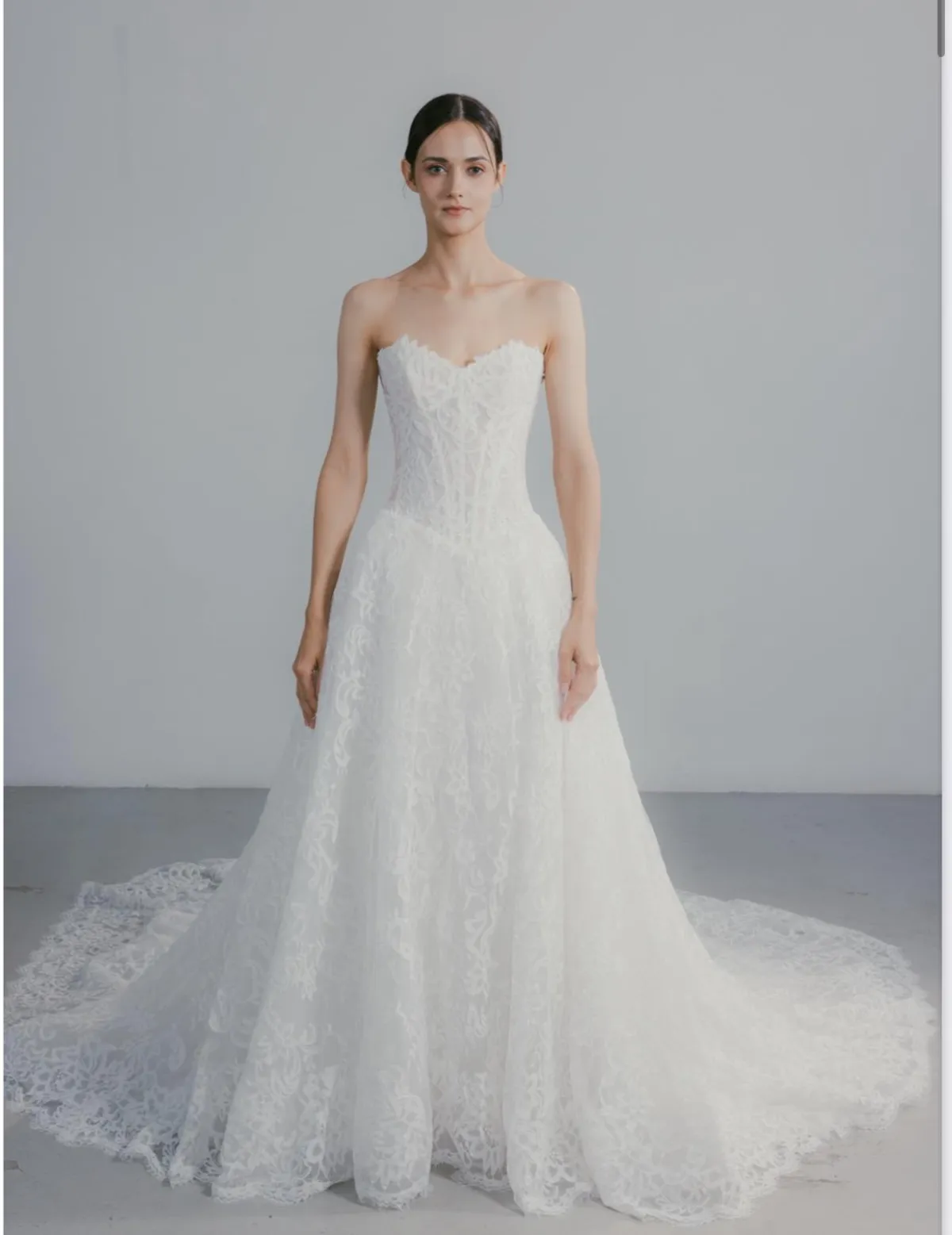 A model showcases the Beccar Verona dress against a white backdrop