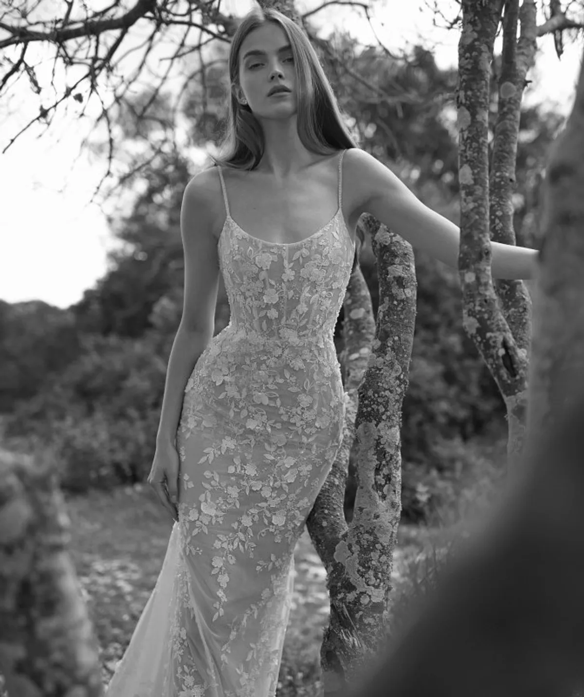 A model showcases the Arava Polak Laurel dress near a tree