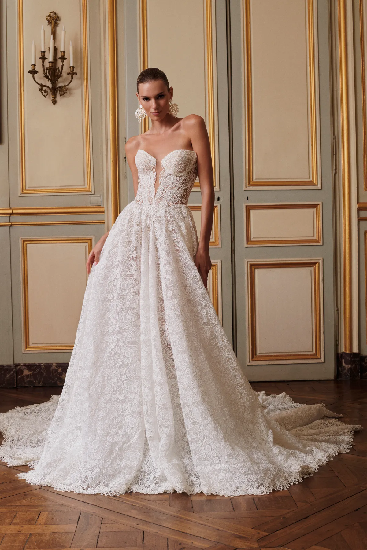 A model showcases the Galia Lahav Opera dress in a ballroom