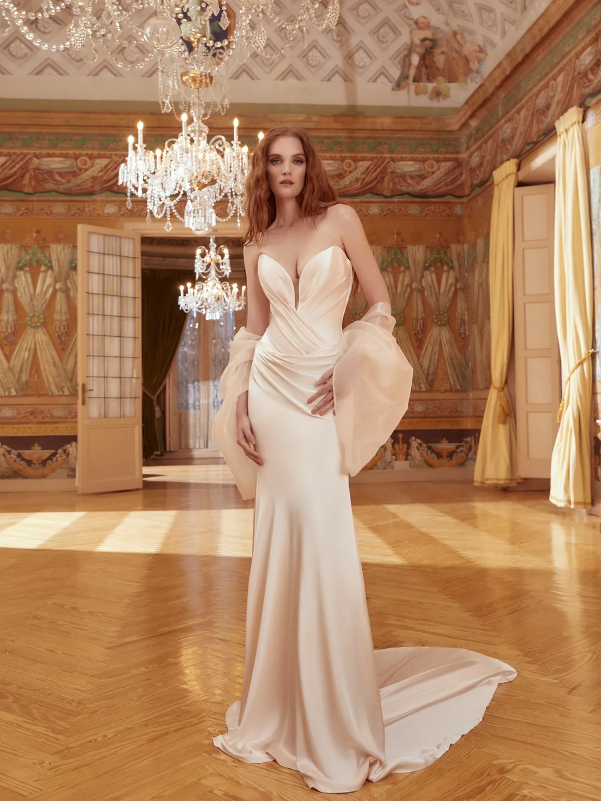 A model showcases the Galia Lahav Raphaella dress in a ballroom